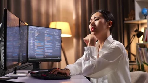 Asian Woman Programmer Thinking About Something While Creating Software Engineer Developing App