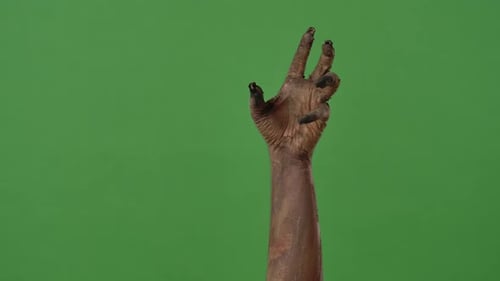 A Creepy Zombie Hand Points to the Side