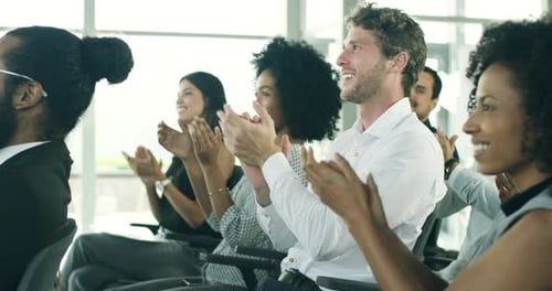Adults Applauding During a Business Meeting