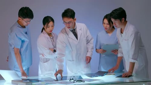 Medical Team Examining X-ray in Futuristic Hospital