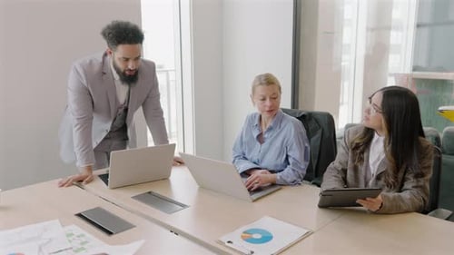 A Diverse Business Team Collaborating Effectively in a Modern Office Environment Today