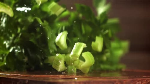 Pieces of Chopped Celery Fall on the Table Filmed on a Highspeed Camera at 1000 Fps