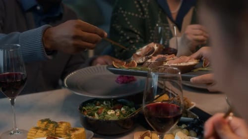 People Sharing a Meal Together at Home