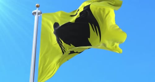 Realistic Yellow Flag Waving with Black Bird Silhouette on Blue Sky