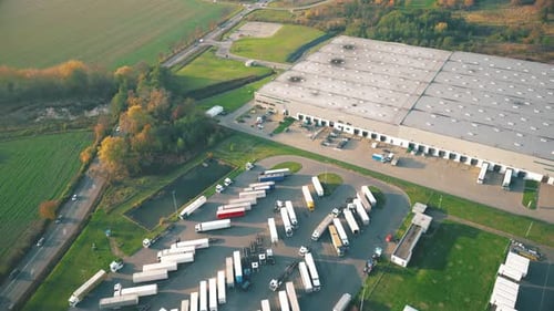 Aerial view of goods warehouse. Logistics center in industrial city zone from above. Aerial view of