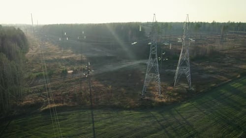 Highvoltage Steel Power Pole From a Bird'seye View Under Sunlight