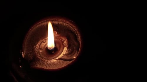 Glowing Diya Lamp Flame in the Dark