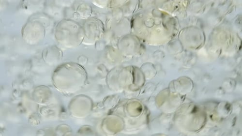 Macro Shot of Clear Bubbles Rising in Liquid