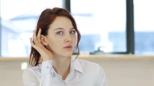 Woman Smiles and Blows a Kiss