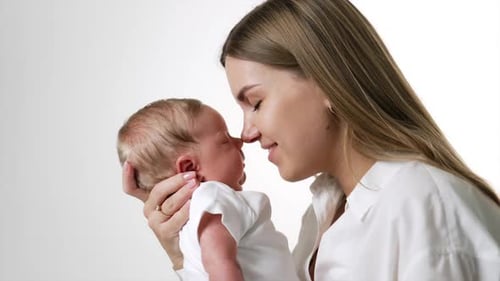 Mother and Infant Touching Noses Tenderly
