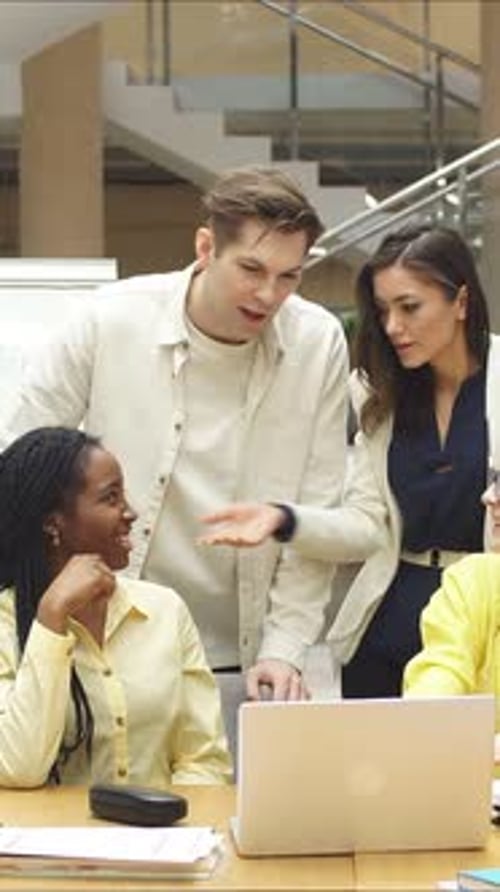Business People Discuss a Startup with Colleagues in a Stylish Office