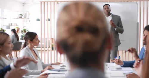 Meeting, presentation and whiteboard with a business black man talking to his team in the office