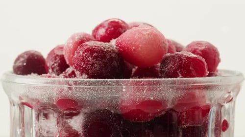 Frozen Cranberries Cooking for Tea or Jam Background Close Up of Cranberry Berries in on the Kitchen