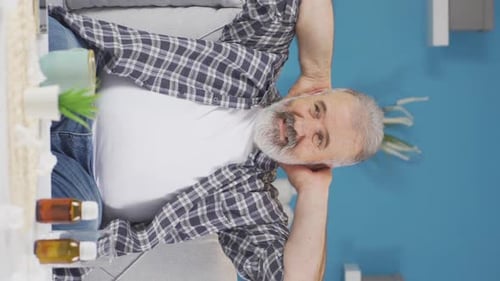Vertical video of Sick old man suffering from neck pain.