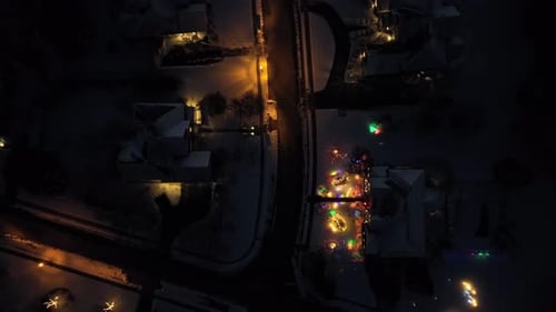 Aerial View of Christmas Lights in Winter Neighborhood