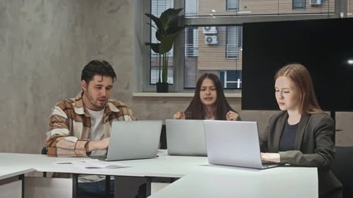 Young Professionals Celebrate Project Completion with Paper Airplanes