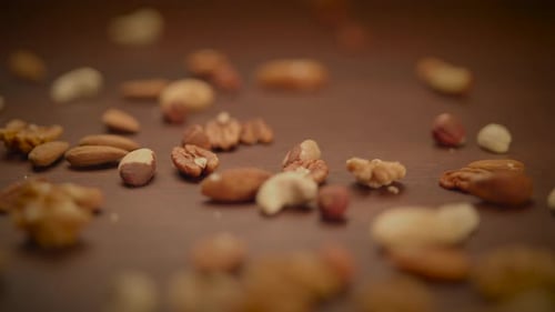 Various Nuts Scattered on a Wooden Surface