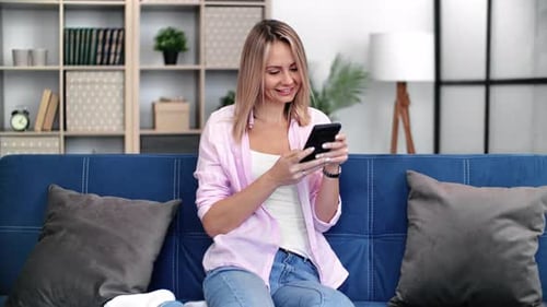 Happy Young Casual Woman Chatting Smartphone Browsing Internet Remotely Communication