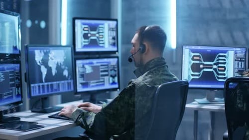 Man and Woman Working in Futuristic Control Room