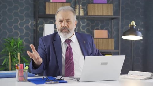 Man in Suit on Video Call in Office