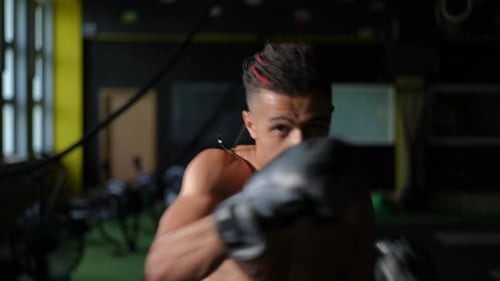 A Dynamic Boxing Training Session Taking Place in a Modern Gym Environment Today