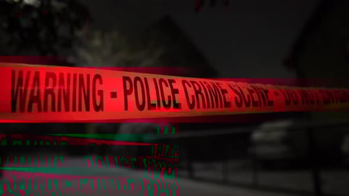 Police crime scene tape warns of danger at night