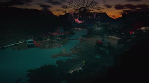 Rusting vehicles and old structures in a desolate desert landscape at sunset