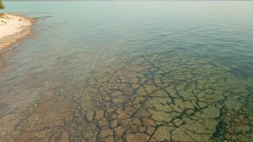 Transparent Water Of A Rocky Beach In Croatia During Summer. Aerial Drone Shot
