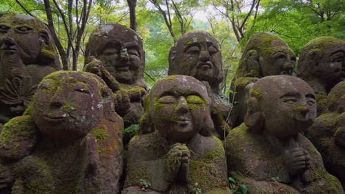 Each statue in this Buddhist temple has a different shape and facial expression giving the place a v