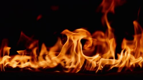 Fire Burning Flame Tongues of Orange Flame Bright Burning Flames on a Black Background Fire in Slow