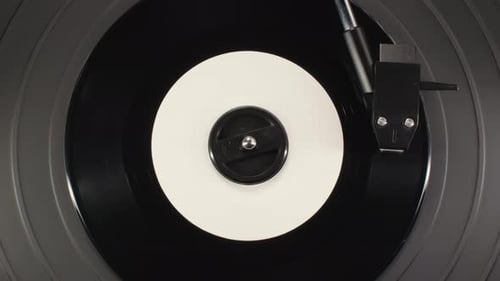 Rotating Black Vinyl Record on Turntable