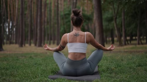 Woman Meditating Outdoors in Green Park