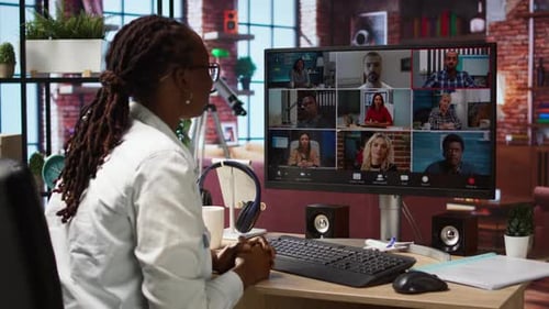 Remote Employee in Home Office Saluting Colleagues During Online Videocall