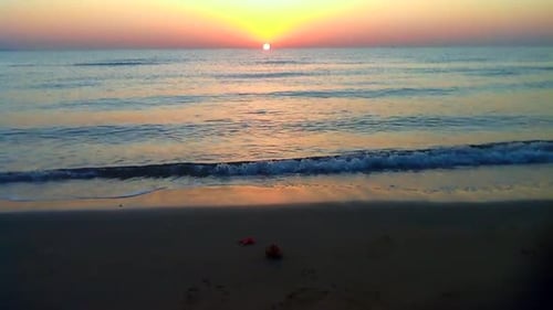 Watching the early morning sun rise across the Ocean