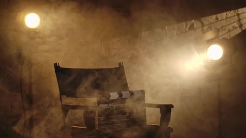 Director's Chair with Clapboard in Dramatic Lighting
