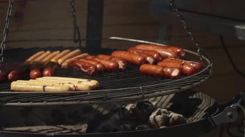 Sausages of Various Sizes and Compositions are Prepared on Round Outdoor Grill
