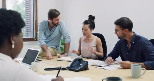 Diverse Team Collaborating in Modern Office Meeting