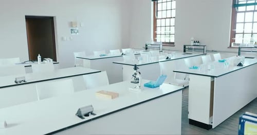 Science, classroom and learning with empty room of laboratory for education
