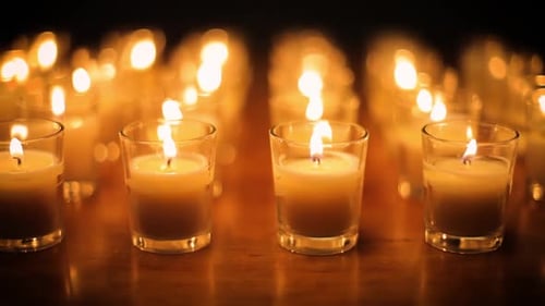Rows of candles in a church or temple.