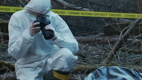 Forensic Specialist Working in the Forest Police Criminalists Collecting Evidence and Making