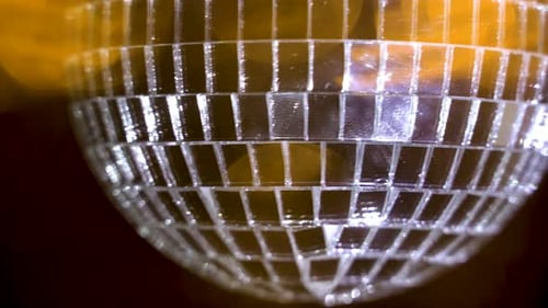 Dazzling Disco Ball Reflecting Light in Nightclub