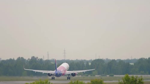 Passenger Plane Takes Off From Airport Runway