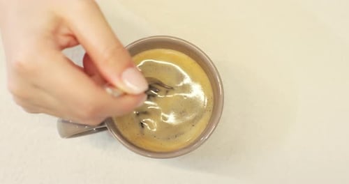Top View of a Woman Hand Brewing Hot Coffee on the Table Hot Coffee Drink Concept