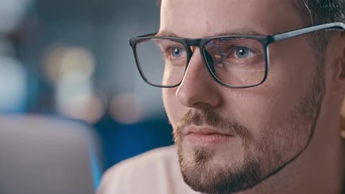 Man With Glasses Looking at Computer Screen Closely