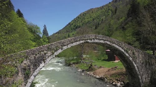 View of historical arch bridge with drone