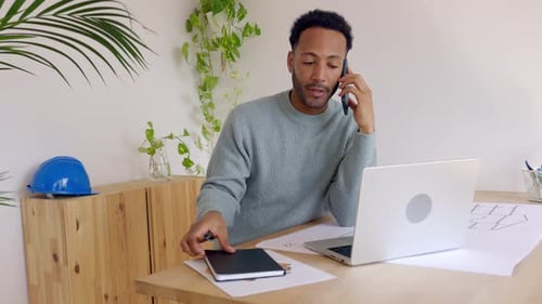 Architect Designer Engineer Working on Building Plan Project at Studio Office