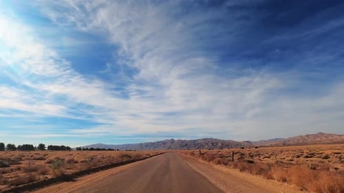 Hyperlapse Driving on Highway in Golden Brown Mojave Desert Landscape