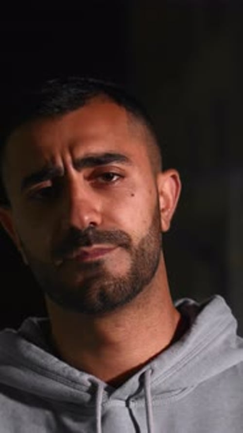 Close-Up of a Man in Gray Hoodie