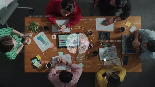 Brainstorm Meeting Overhead View with Technology Graphics