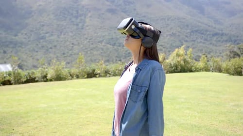 Woman Enjoys VR Headset with Mountain Views